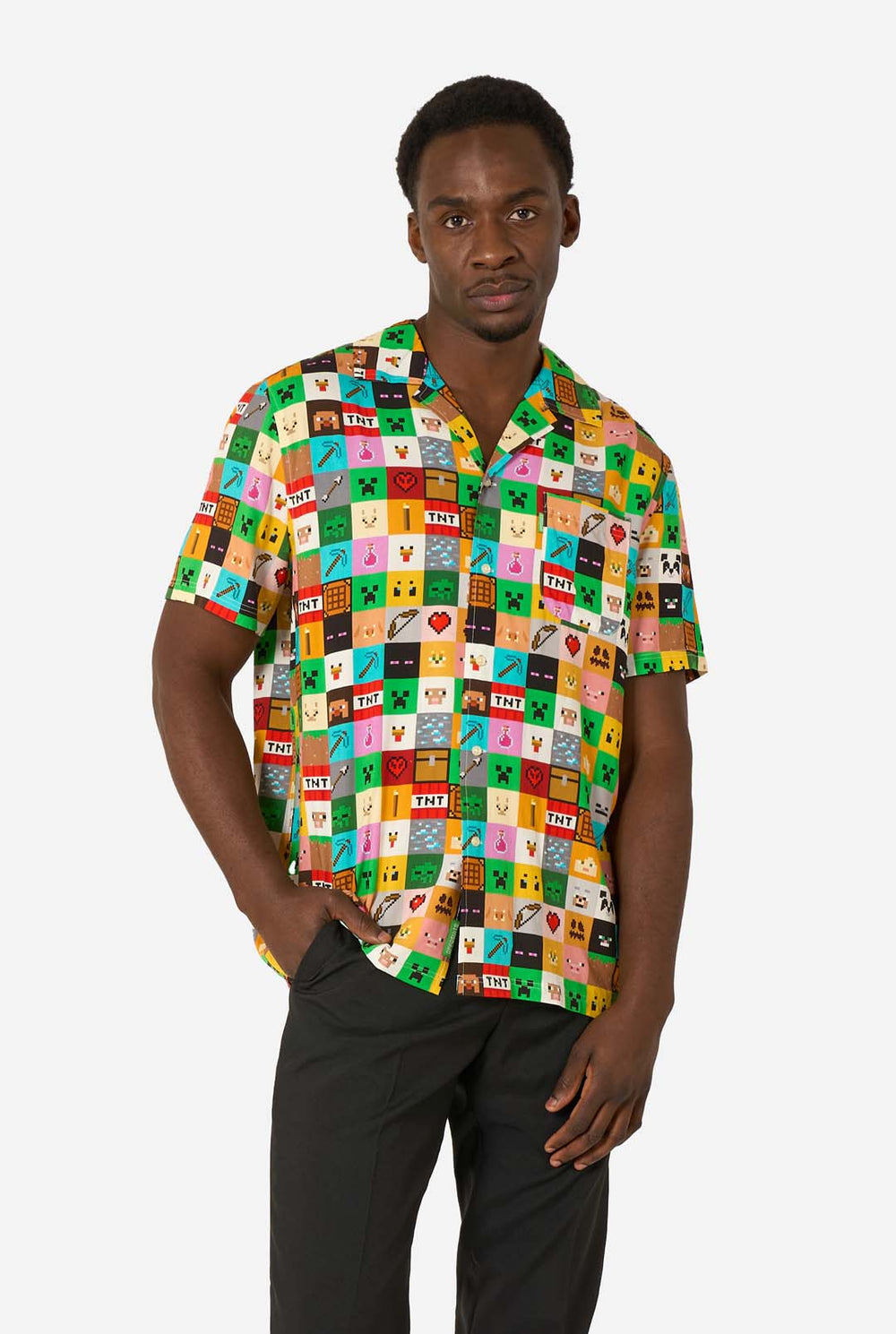 Man wearing a colorful patterned Minecraft shirt on a white background