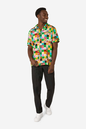 Man wearing a colorful patterned Minecraft shirt on a white background