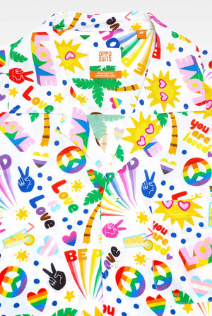 Image of a white Hawaiian shirt with a rainbow pride print, Print consists of peace symbols, hearts and other icons, Showing upper part of the Hawaiian shirt.
