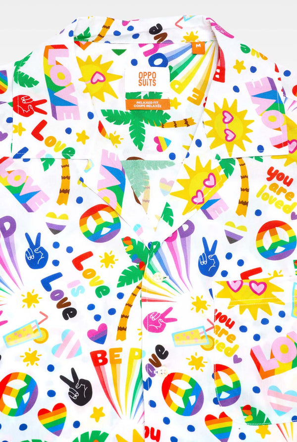 Image of a white Hawaiian shirt with a rainbow pride print, Print consists of peace symbols, hearts and other icons, Showing upper part of the Hawaiian shirt.