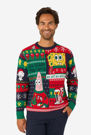 Man wearing a colorful Christmas-themed sweater with Spongebob character designs on a white background