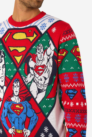 Superman-themed Christmas sweater with colorful patterns and symbols.
