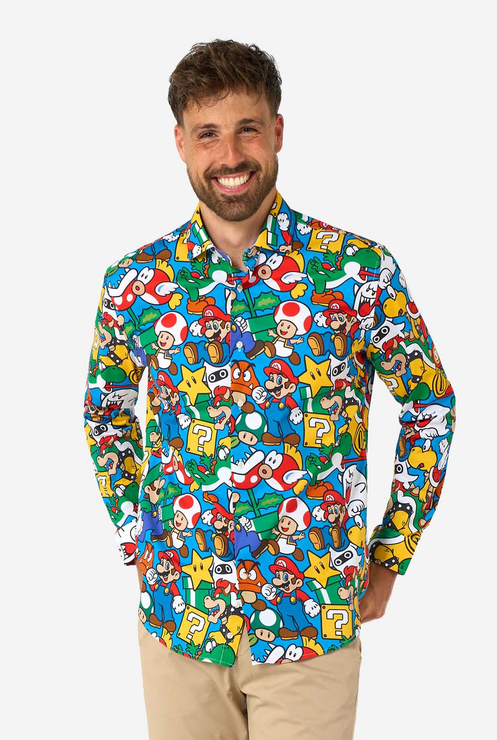Man wearing a colorful shirt with Super Mario characters pattern on a white background.