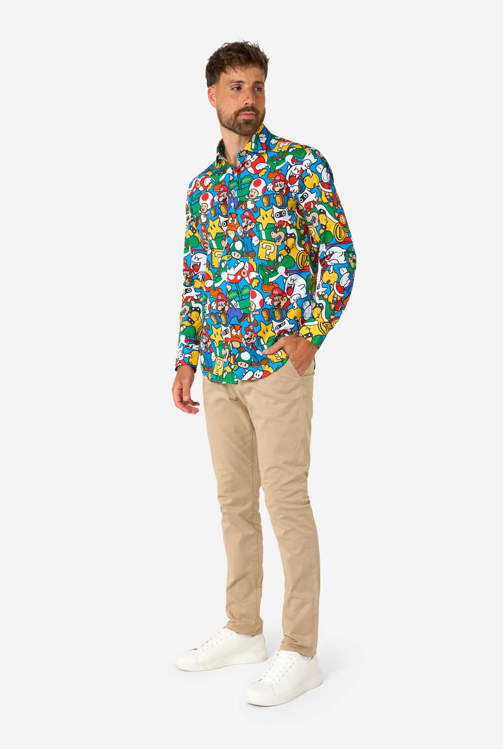 Man wearing a colorful shirt with Super Mario characters pattern on a white background.