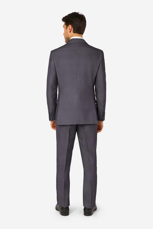 Man wearing a gray suit on a white background. View from the back