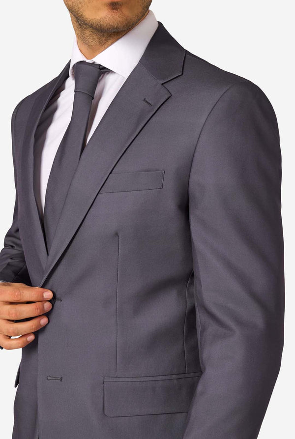 Gray suit jacket worn by a person on a white background