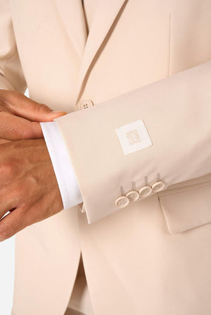 Close-up of a sand colored suit with a visible brand label.