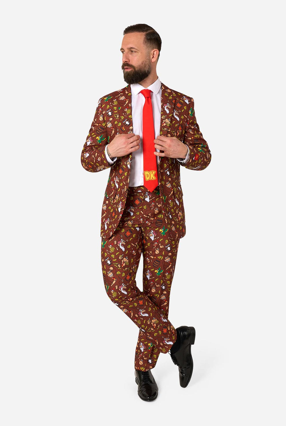 Man wearing a Donkey Kong patterned suit with a red tie on a white background