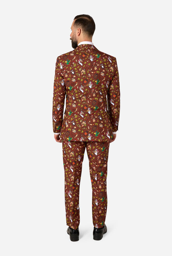 Man wearing a Donkey Kong patterned suit on a white background. View from the back.