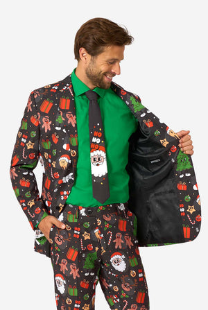Man wearing a festive suit with Christmas-themed pattern, holding the jacket open.