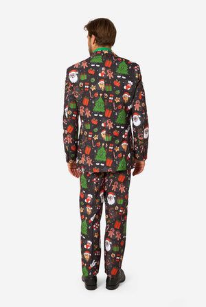 Person wearing a festive Christmas-themed suit with various patterns on a white background