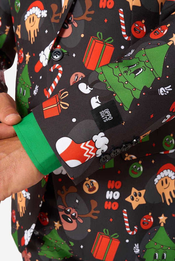 Black sleeve with Christmas-themed design held by a hand