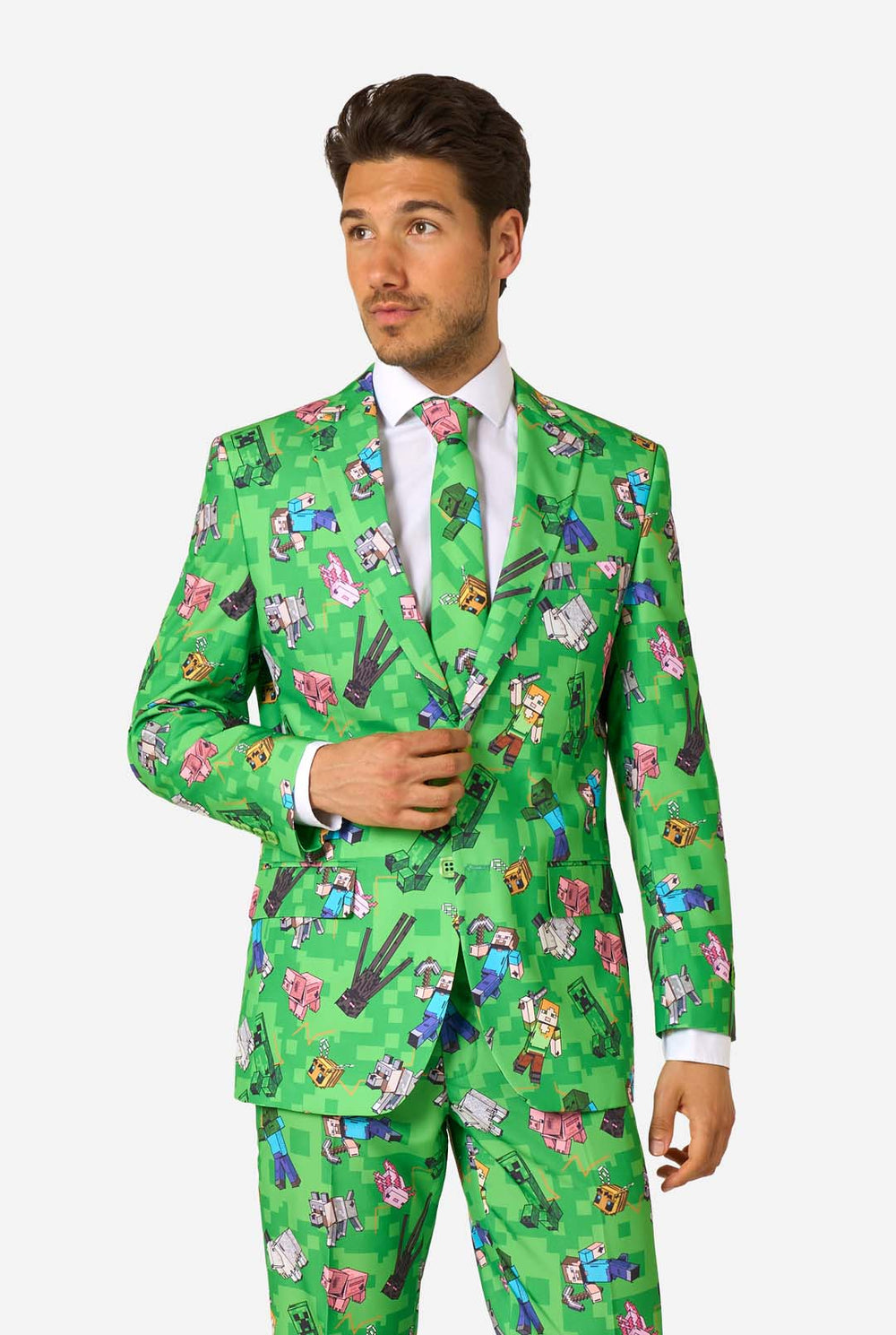 Man wearing a green patterned Minecraft suit on a white background