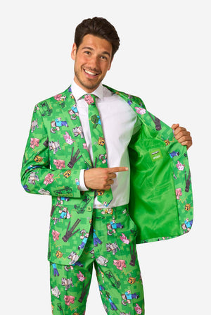 Man wearing a colorful green suit with Minecraft character pattern on a white background