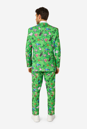 Person wearing a green Minecraft patterned suit on a white background
