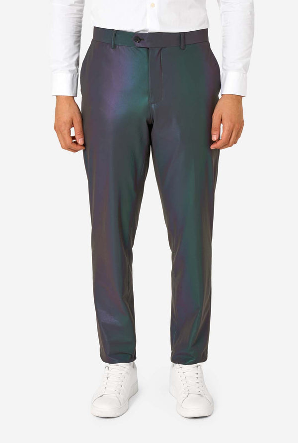 Person wearing iridescent pants with a white shirt and white sneakers on a white background