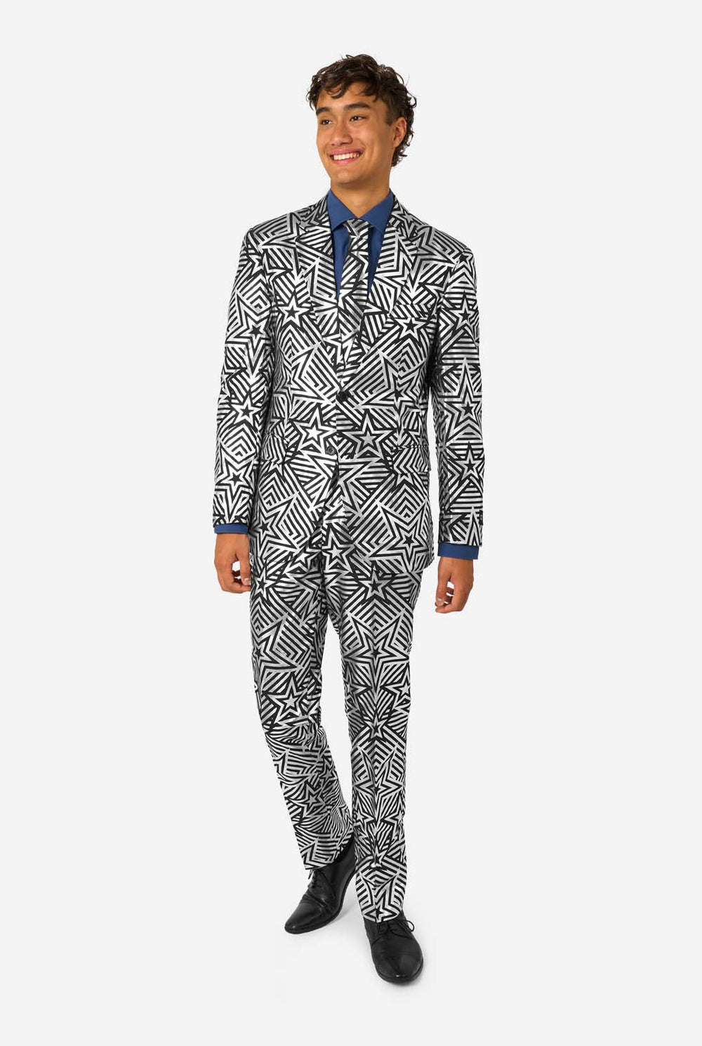 Man wearing a black and white star patterned suit on a white background