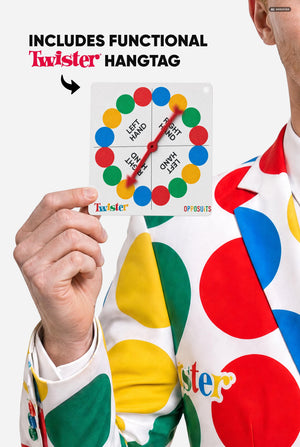 A man wearing a white suit with large multicolored polka dots and the Twister logo, resembling a Twister mat, against a light gray studio background. Man holding hangtag made as working spinner card.