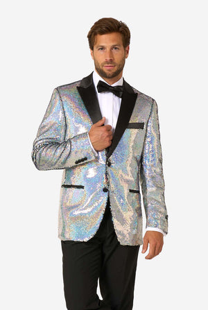 Man wearing a holographic sequin jacket with black lapels on a white background