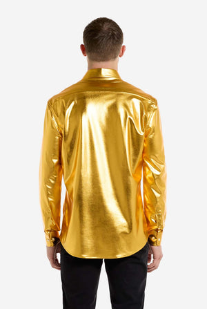 Person wearing a shiny gold shirt on a white background