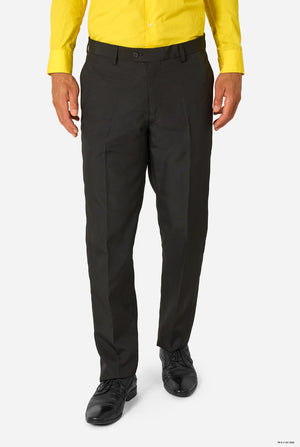 Person wearing black pants and a yellow shirt on a white background
