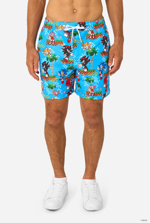 Person wearing colorful Sonic-themed shorts on a white background