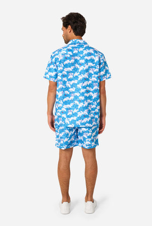 Man wearing a blue and white patterned shirt and shorts set on a white background. View from the back