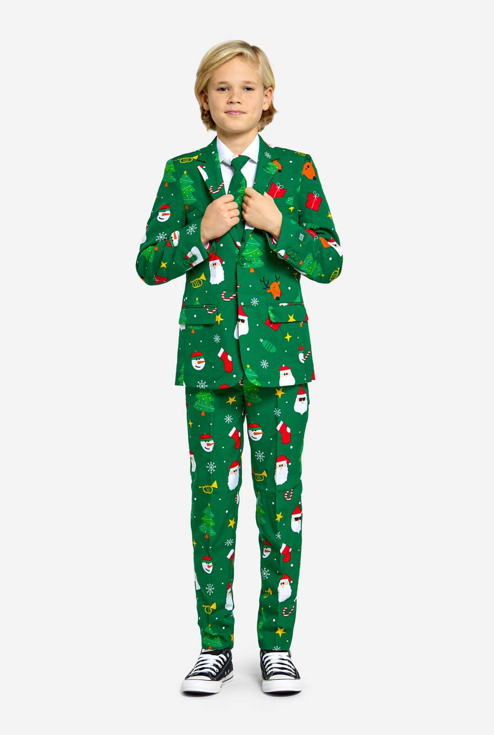Teen wearing green Christmas suit for teens, with Christmas icons.