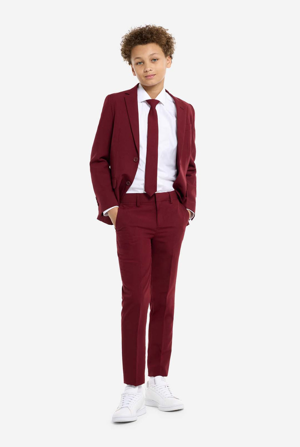 Teen wearing formal burgundy red suit, kid holding tie