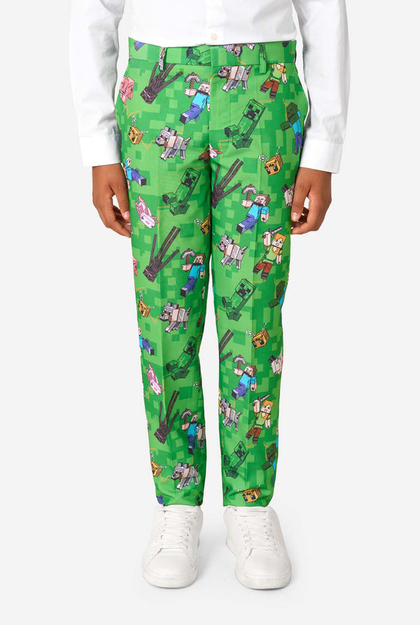 Green pants with Minecraft character pattern worn by a person on a white background