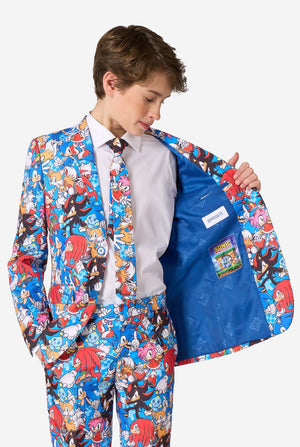 Child wearing a colorful Sonic-themed suit with a white shirt and blue vest.