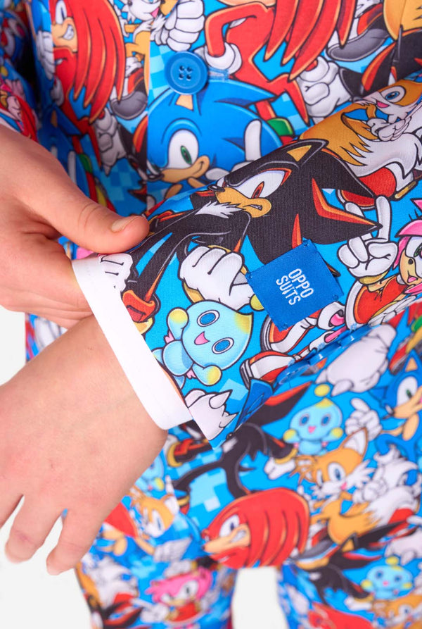 Colorful fabric with Sonic character pattern, held by a hand.