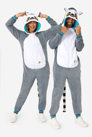 Two people wearing gray lemur onesies with lemur designs on a white background. Full body image