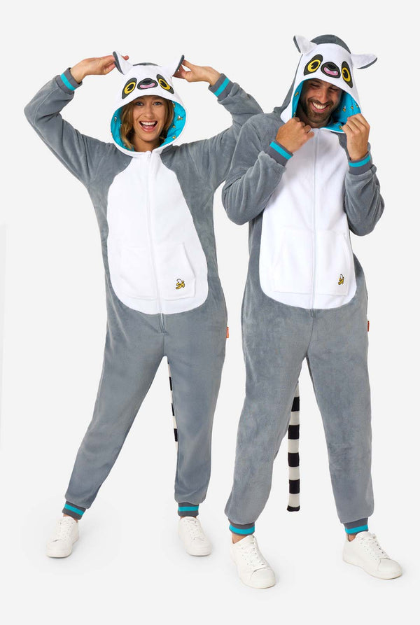 Two people wearing gray lemur onesies with lemur designs on a white background. Full body image
