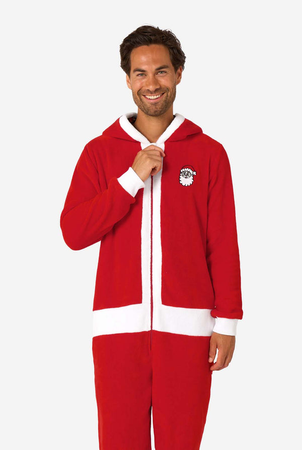 Man wearing a red onesie with a white logo on a white background