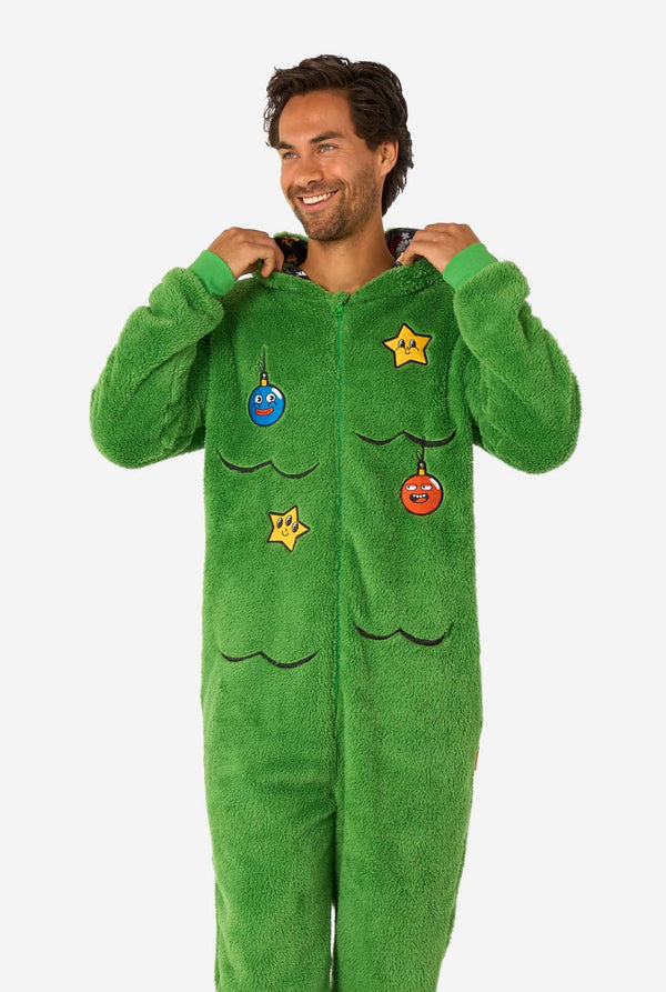 Person wearing a green onesie with decorative elements on a white background