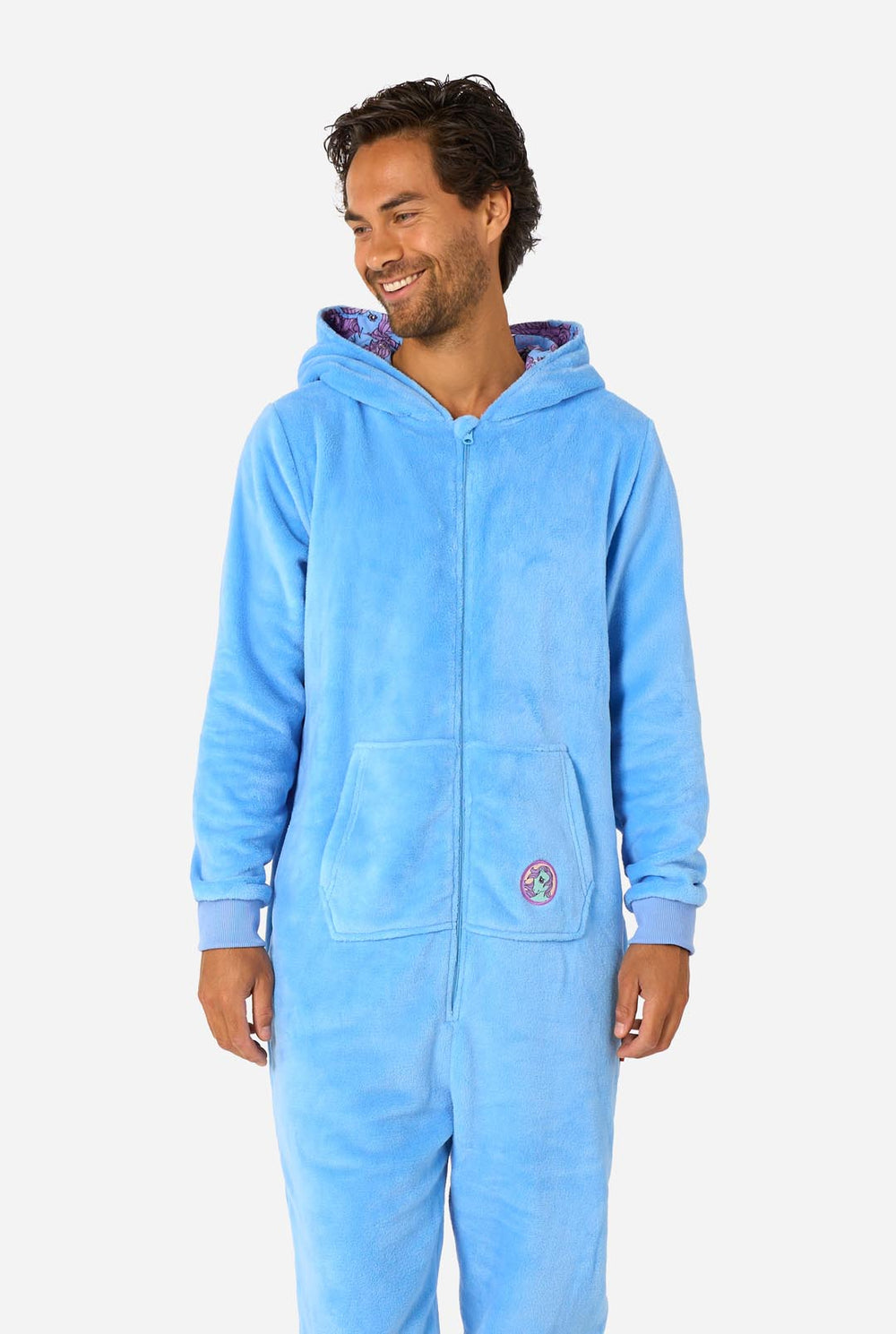 Person wearing a blue My Little Pony onesie with a hood on a white background