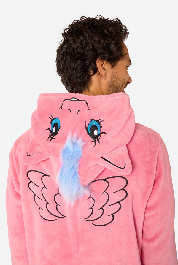 Person wearing a pink My Little Pony onesie with cartoon face design on a light gray background