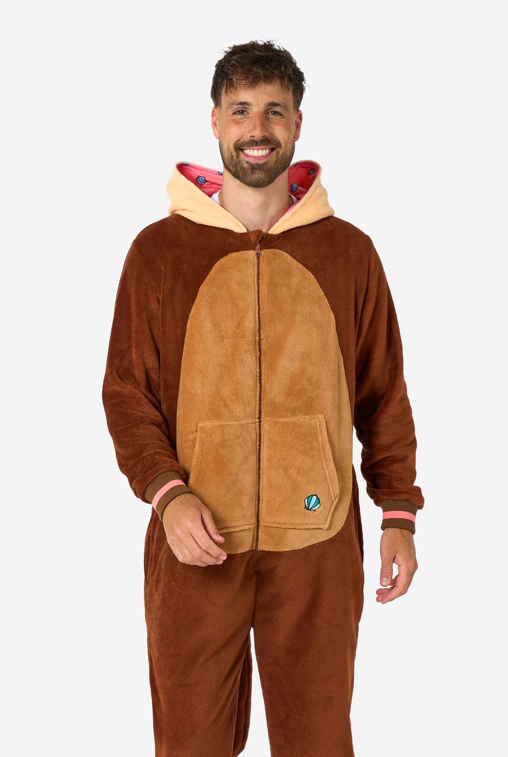 Two people wearing brown otter-themed onesies on a white background