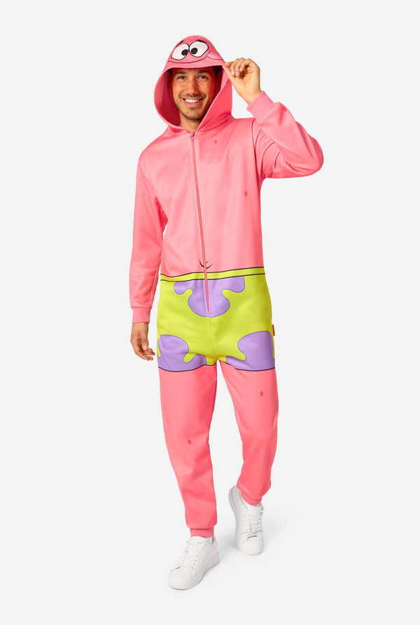 Person wearing a pink onesie with a hood and green shorts on a white background. Full body image