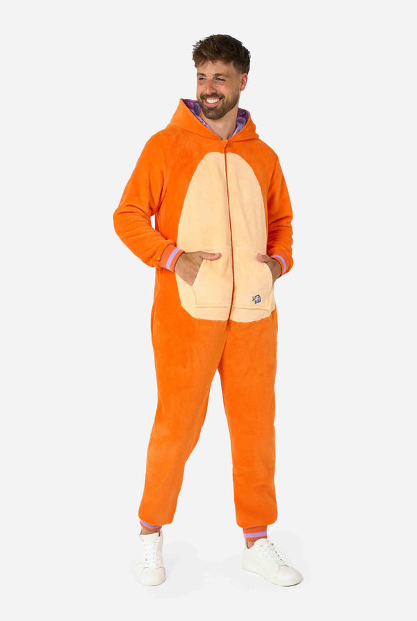 A smiling man is wearing an orange adult onesie designed as a red cat onesie. The onesie features a hood resembling a cat's head, and cat details, perfect for cozy lounging or costume parties. Full body image with hood on his back.