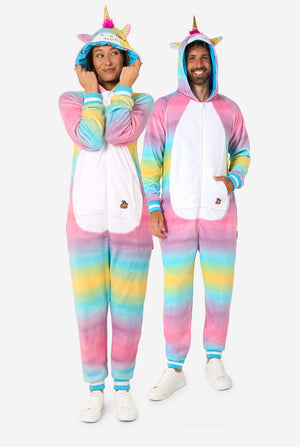 Two people wearing colorful unicorn-themed onesies on a white background. Full body image
