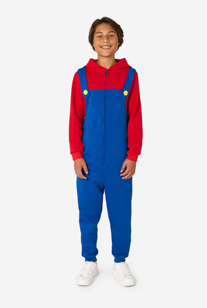 Person wearing a red and blue Mario jumpsuit on a white background