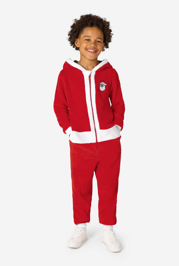 Child wearing a red onesie with white accents on a white background. Full body image