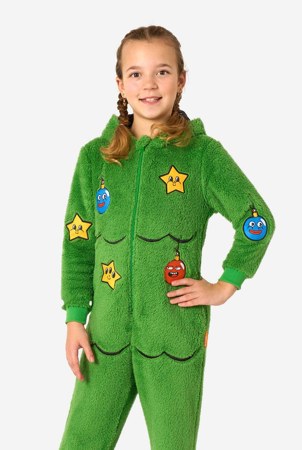 Child wearing a green onesie with star-shaped patches on a white background