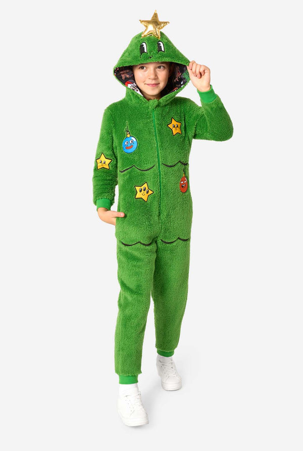Child wearing a green onesie with star designs on a white background. Full body image