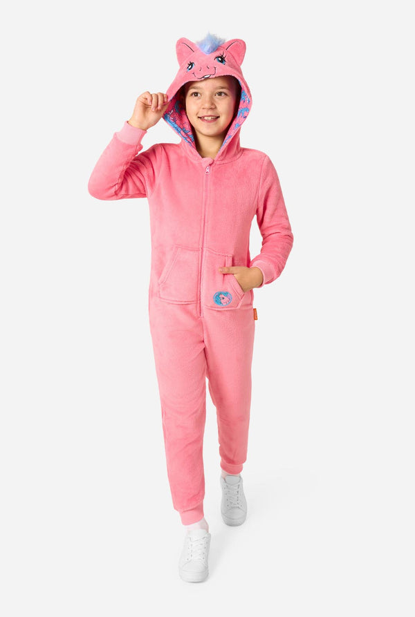 Child wearing a pink My Little Pony onesie with a hood and ears on a white background. Full body image.