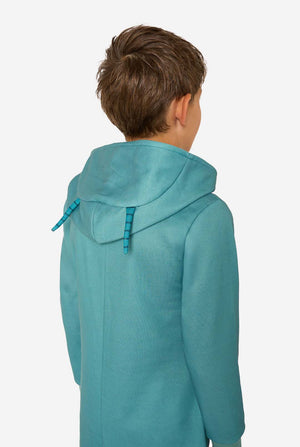Person wearing a teal Plankton onesie on a white background
