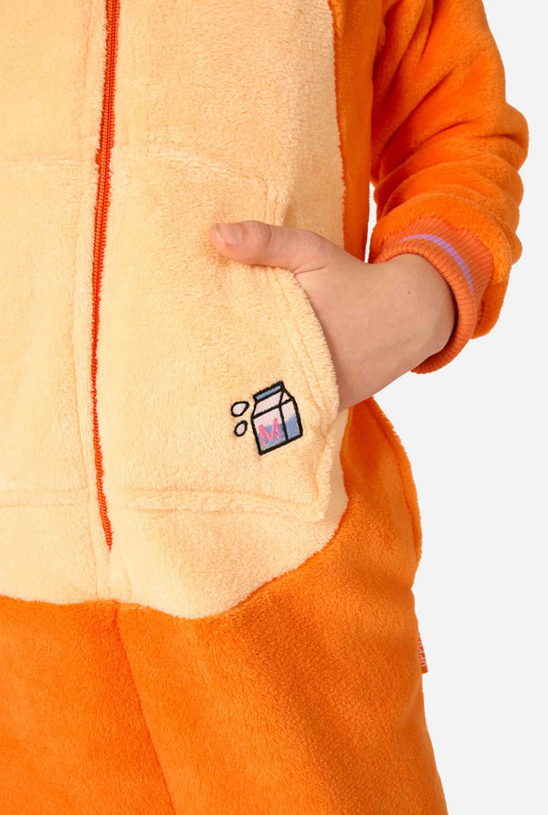 Close-up of a person wearing an orange and beige onesie with a small logo on the chest pocket.