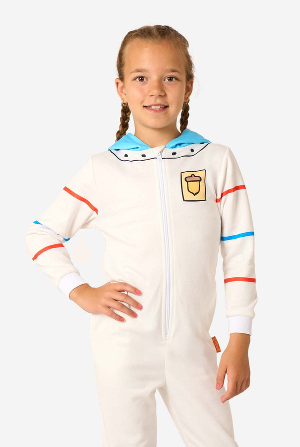 Child wearing a white onesie with colorful accents on a white background